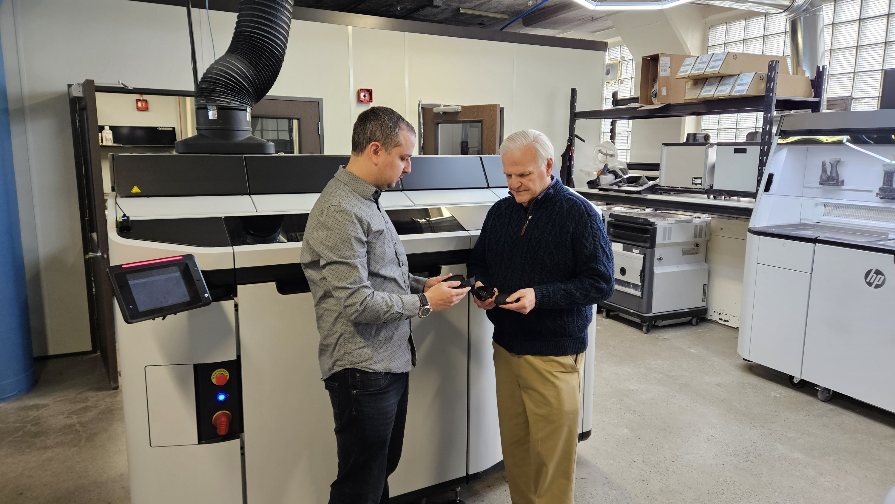 Mike Vindler of Tronix3D and Elry Cramer of Buchanan Sales evaluate printing parts that are designed to convert to injection molding when volume warrants it.