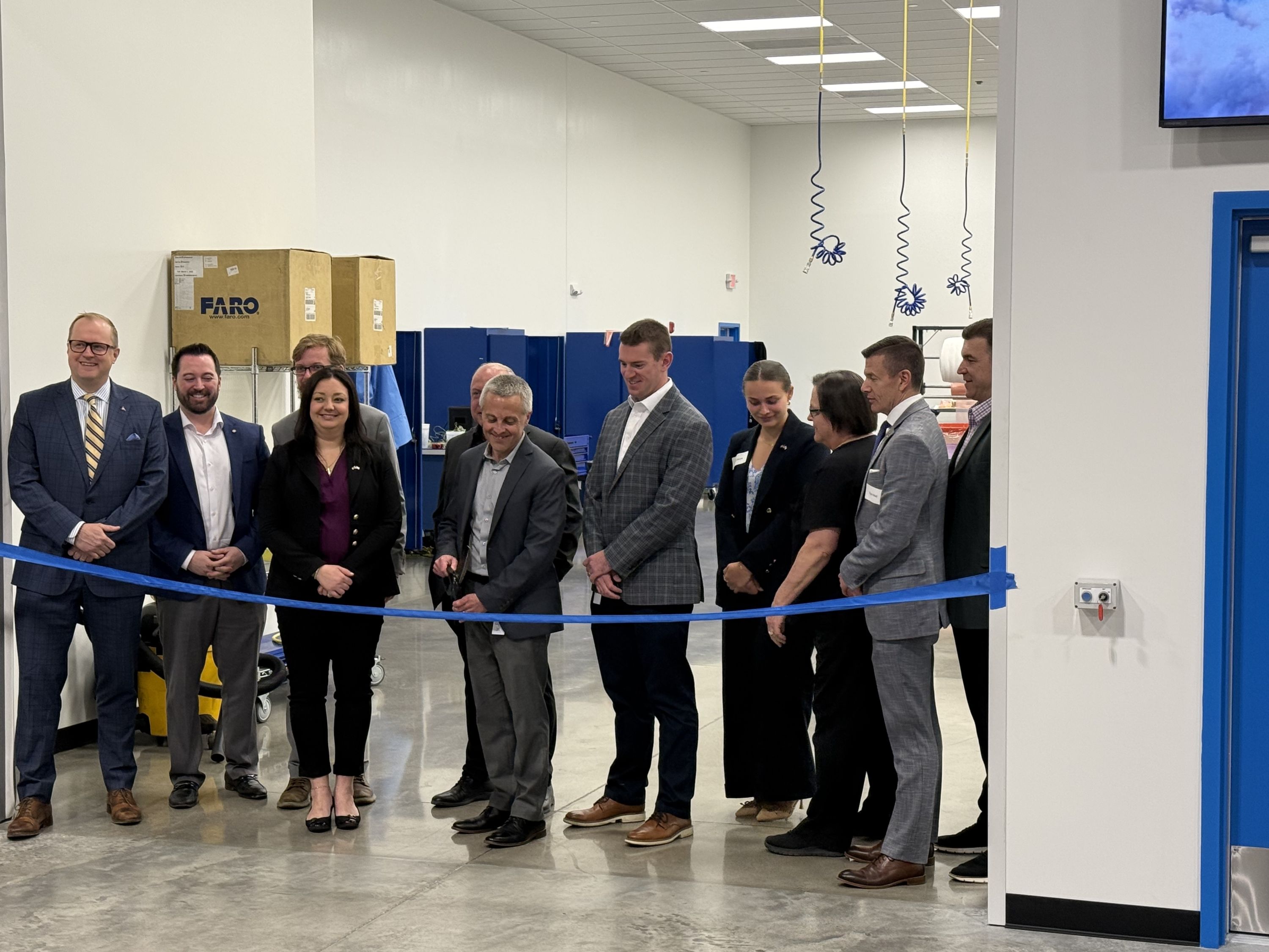 Dan Connell cuts the ribbon to officially open the expansion at Touchstone Advanced Composites.