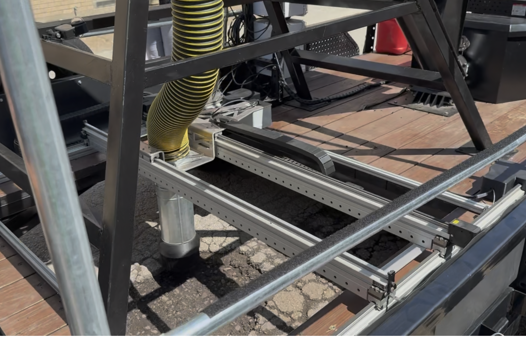 Mounted on a trailer is a bespoke assortment of technology. At the heart of the robot is a time-of-flight camera that creates a 3D image of the pothole. Software determines the hole’s dimensions, contour and volume, calculates how much asphalt is needed and creates a tool path directing the machine where to dispense material.