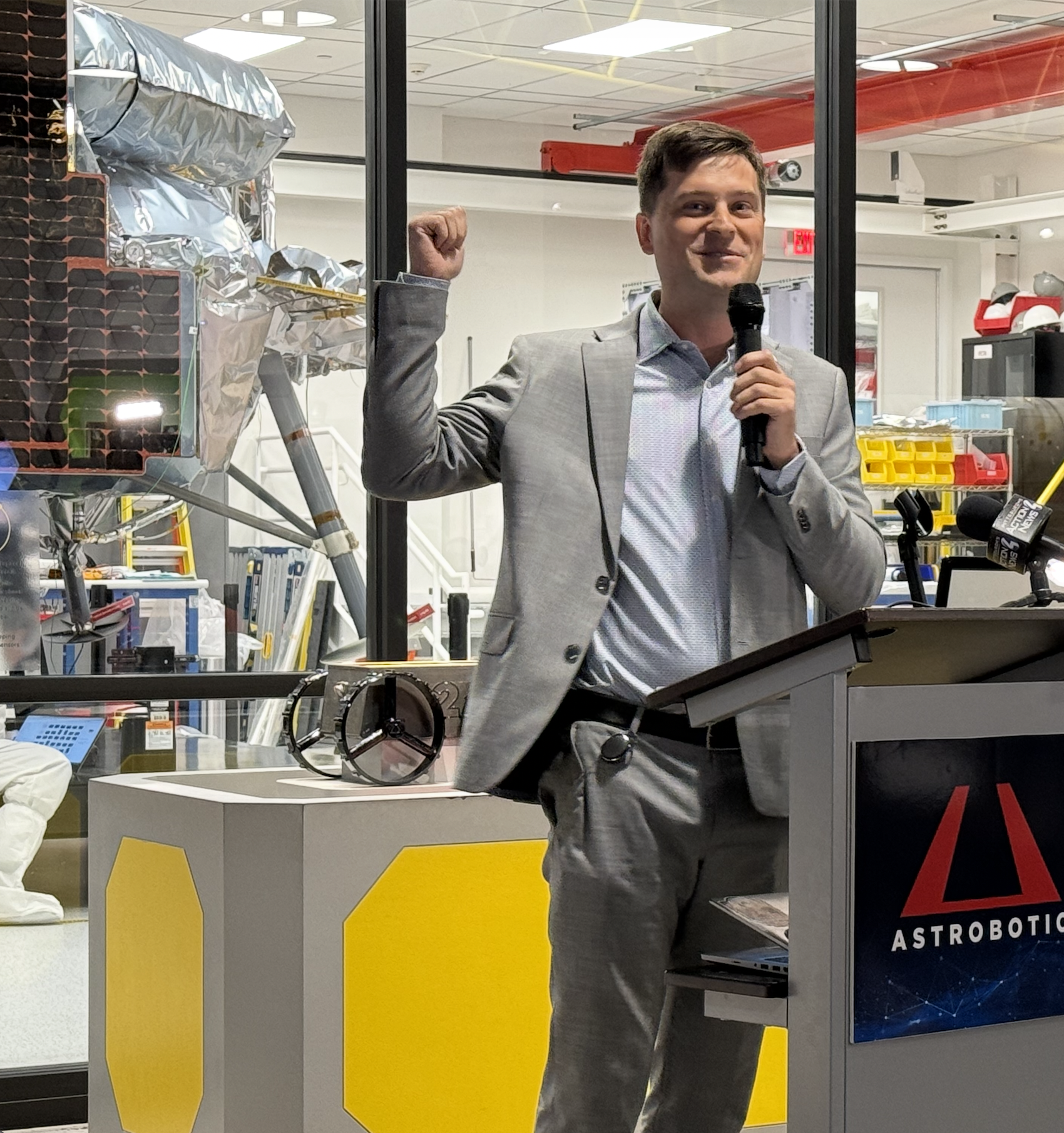 Astrobotic CEO John Thornton points back to the star of the show -- Griifin-1!